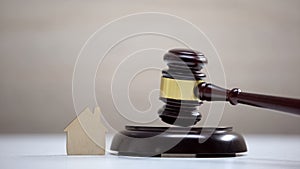 Wooden house sign on table, gavel standing on sound block, private property