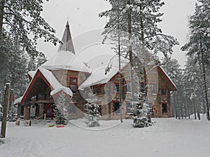 Wooden house, snowy Santa Claus Village, Rovaniemi, Finland