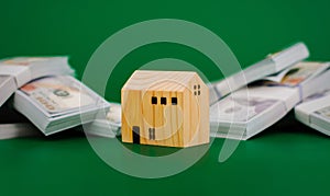 wooden house, toy wooden house with dollars, first house, real estate, home loan, home loan, rental house, renting a house