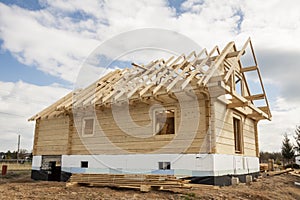Wooden house under construction.