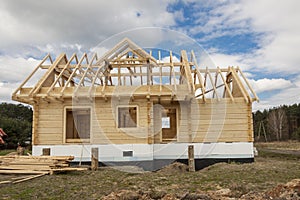 Wooden house under construction.