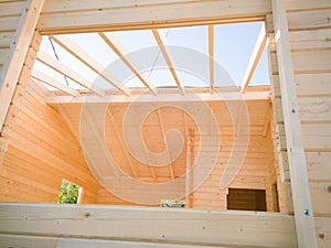 Wooden house under construction photo
