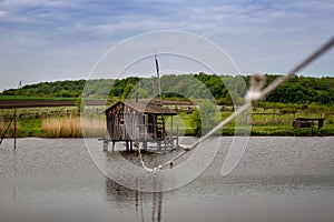 Wooden house on the water for fishing and hunting