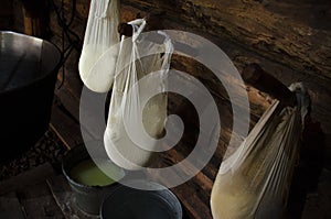 A wooden house where shepherds live and cook cheese from milk of cows and sheep high in the mountains. Homemade cheese