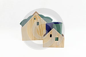 Wooden houses as Christmas decorations and practical napkin stands