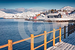 Wooden houses and empty pier on small fishing port - Ramberg, Norway, Europe.