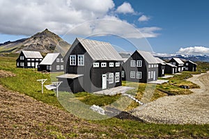 Wooden houses in Icelandic Hellnar village photo