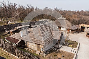 Wooden houses in the National Reserve `Zaporizhzhia Sich` on the island of Khortytsia in Zaporizhzhia. Ukraine. photo