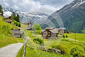 Wooden houses near Golzerensee lake above Bristen village in Switzerland