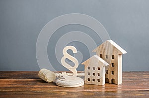 Wooden houses and a paragraph figurine with a judge gavel. Concept legislation on residential buildings and infrastructure