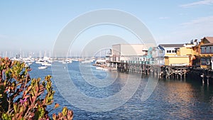 Wooden houses on piles, ocean bay harbor. Old Fisherman's Wharf. Monterey Marina