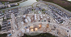 Wooden houses under construction in new developing suburban area. Development of residential housing in American suburbs