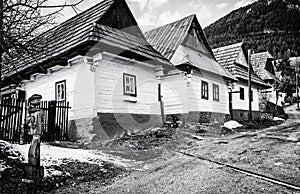 Wooden houses in Vlkolinec village, Slovakia, colorless