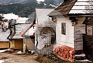 Wooden houses in Vlkolinec village, Slovakia, yellow filter