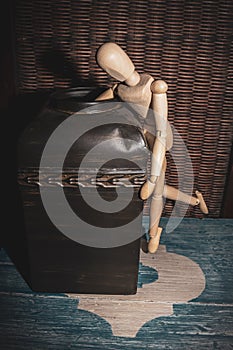 Wooden Human Manikin reaching into an antique metal canister