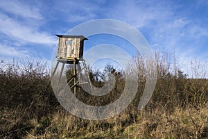 Wooden hunters high seat hide in forest