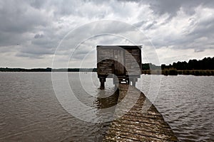 Wooden hunting cabin shore lake nature reserve, het Vinne, Zoutleeuw, Belgium