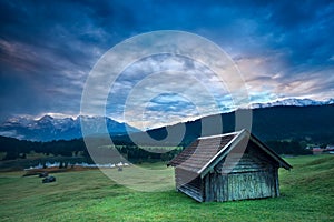 Wooden hut by Geroldsee lake during sunrise