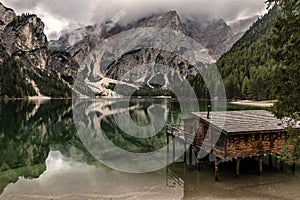A wooden hut on a mountain lake