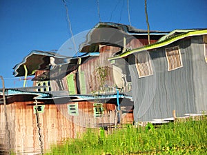 Wooden hut reflected in the waters of Inle Lake