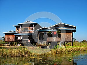 Wooden hut on stilts in the waters of Inle Lake