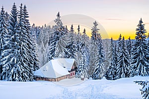 Wooden hut in winter mountains