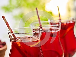 On wooden is ice cold beverage glass with berries cocktail .