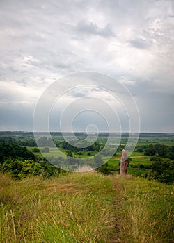 Wooden idol  on a background of blue sky