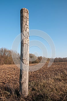 Wooden idol Slavic god Svarog