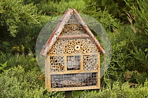 Wooden insect house in a garden