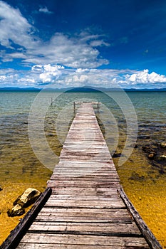 Wooden jetty with beautiful blue sky