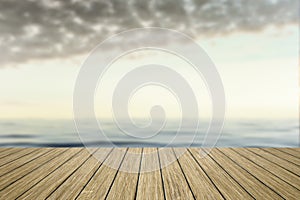 wooden jetty with blurred ocean background
