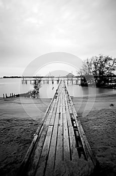 Wooden jetty and dramatic clouds.