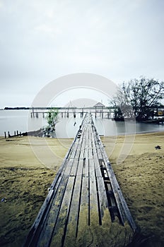 Wooden jetty and dramatic clouds