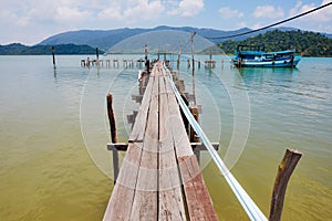 Wooden jetty on exotic beach Koh Chang island, Thailand