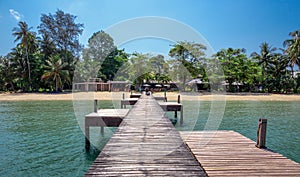 Wooden jetty on exotic beach Koh Chang island, Thailand