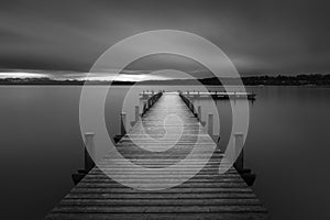 Wooden jetty at lake Starnberger See, Bavaria, Germany