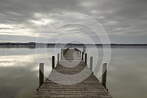 Wooden jetty at lake Starnberger See, Germany