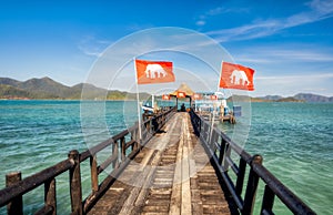 Wooden jetty leading to the moored ship. Koh Laoya Sea of Thailand