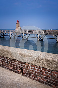 Wooden jetty and lighthouse on the harbour. The treport in Normandy