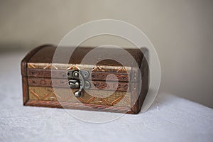 Wooden jewelry box with vintage lock.