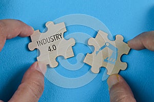Wooden jigsaw puzzle with industry 4.0 symbol. Future technology concept