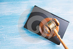Wooden judge gavel and law books