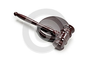 Wooden judge gavel and soundboard isolated on a white background