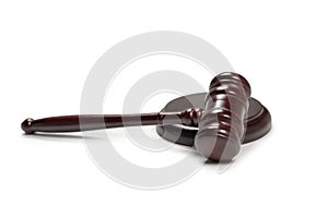 Wooden judge gavel and soundboard isolated on a white background