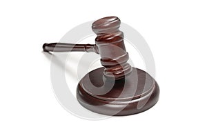 Wooden judge gavel and soundboard isolated on a white background