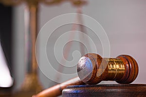 Wooden judge`s gavel. The criminal law.