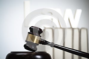 Wooden judge`s gavel. The criminal law.