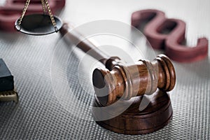 Wooden judge`s gavel. The criminal law.