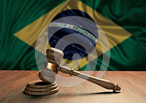 Wooden judge`s gavel Symbol of law and justice with the flag of Brazil. Brazilian judicial system